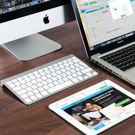 Polished desk setup with desktop and laptop devices