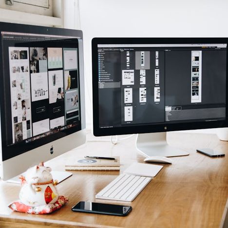 Dual-monitor design workspace with a clean desk setup