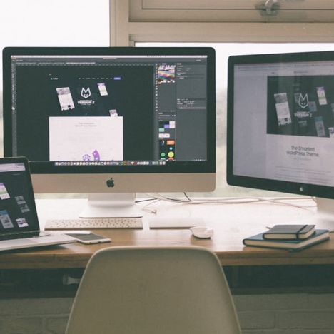 Modern workspace with multiple monitors and devices